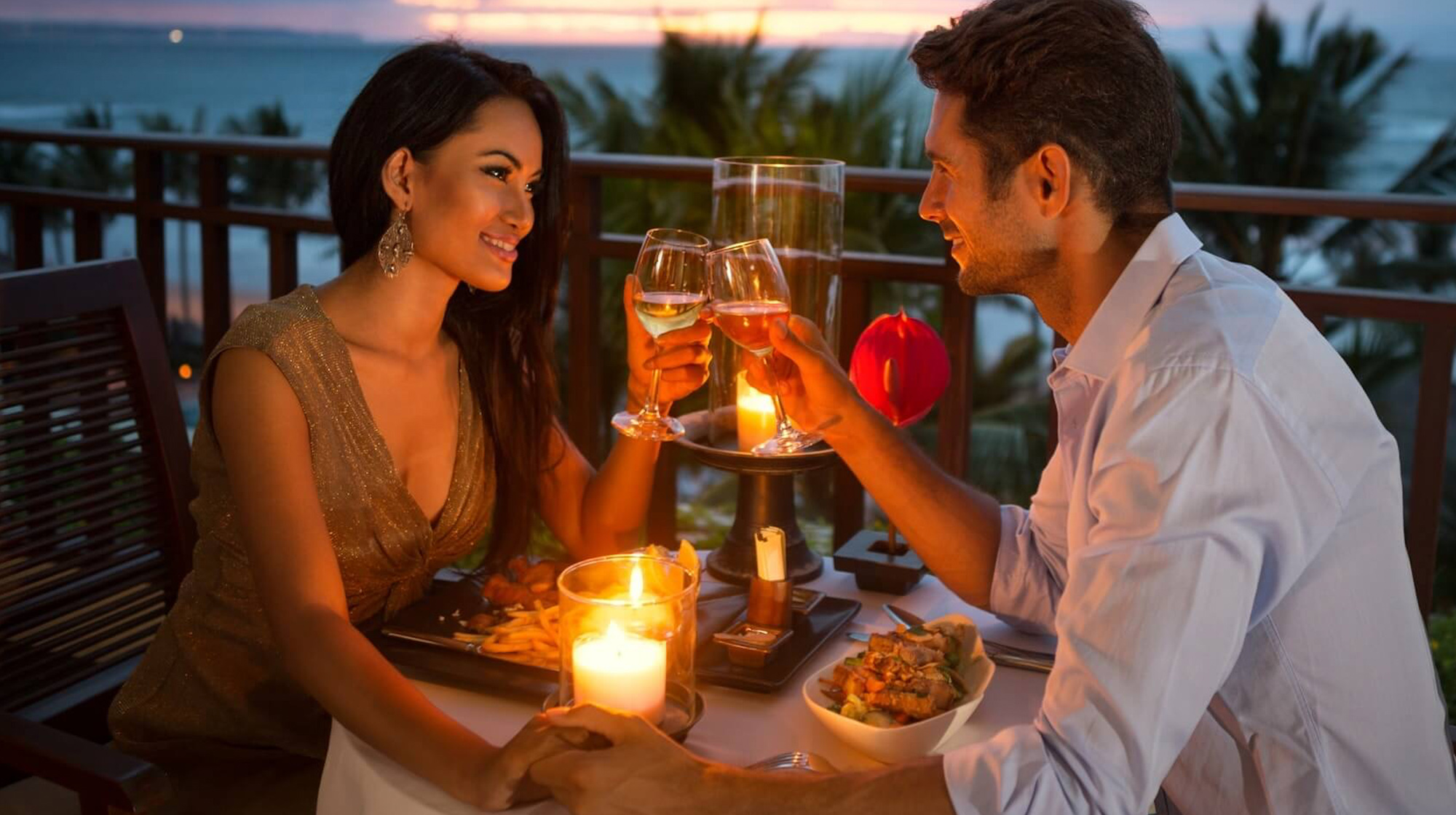 The image display a couple having a romantic dinner
